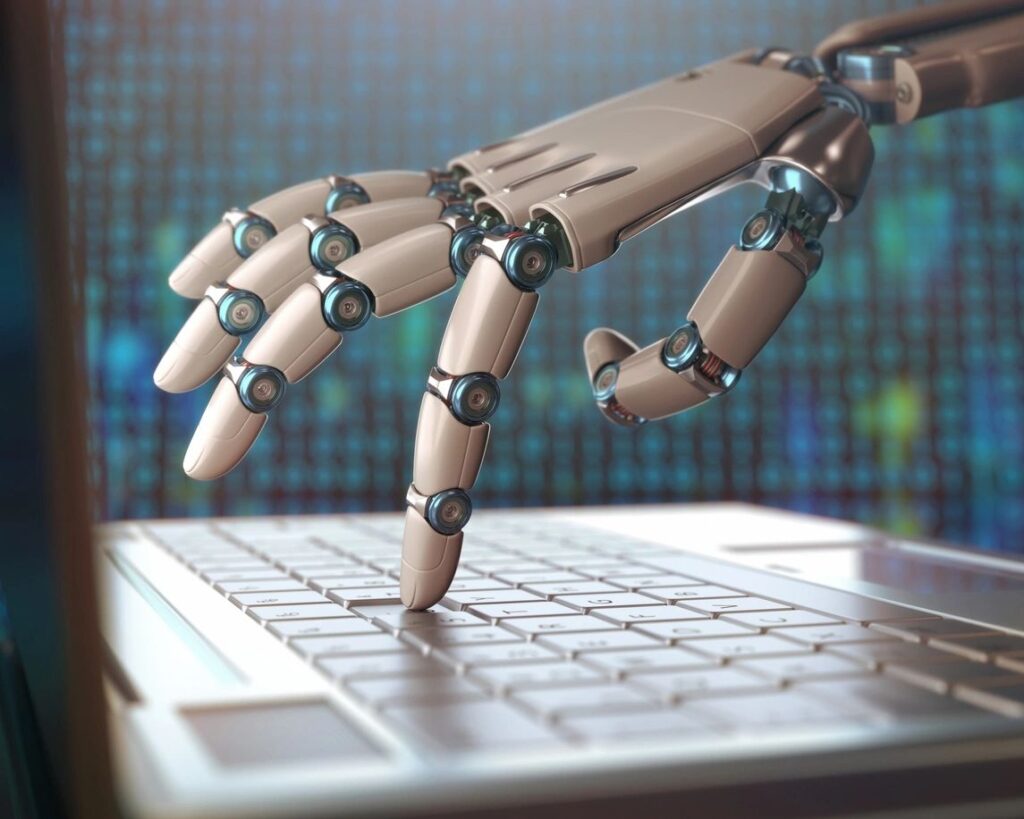 A robot hand is reaching out of the keyboard.